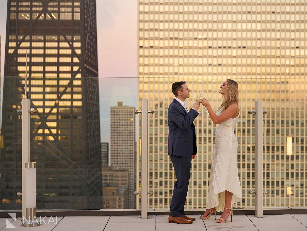 engagement photos chicago roof top sunset champange