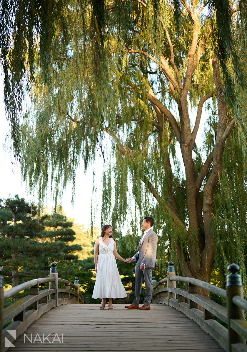 chicago botanic garden engagement photos couple on bridge