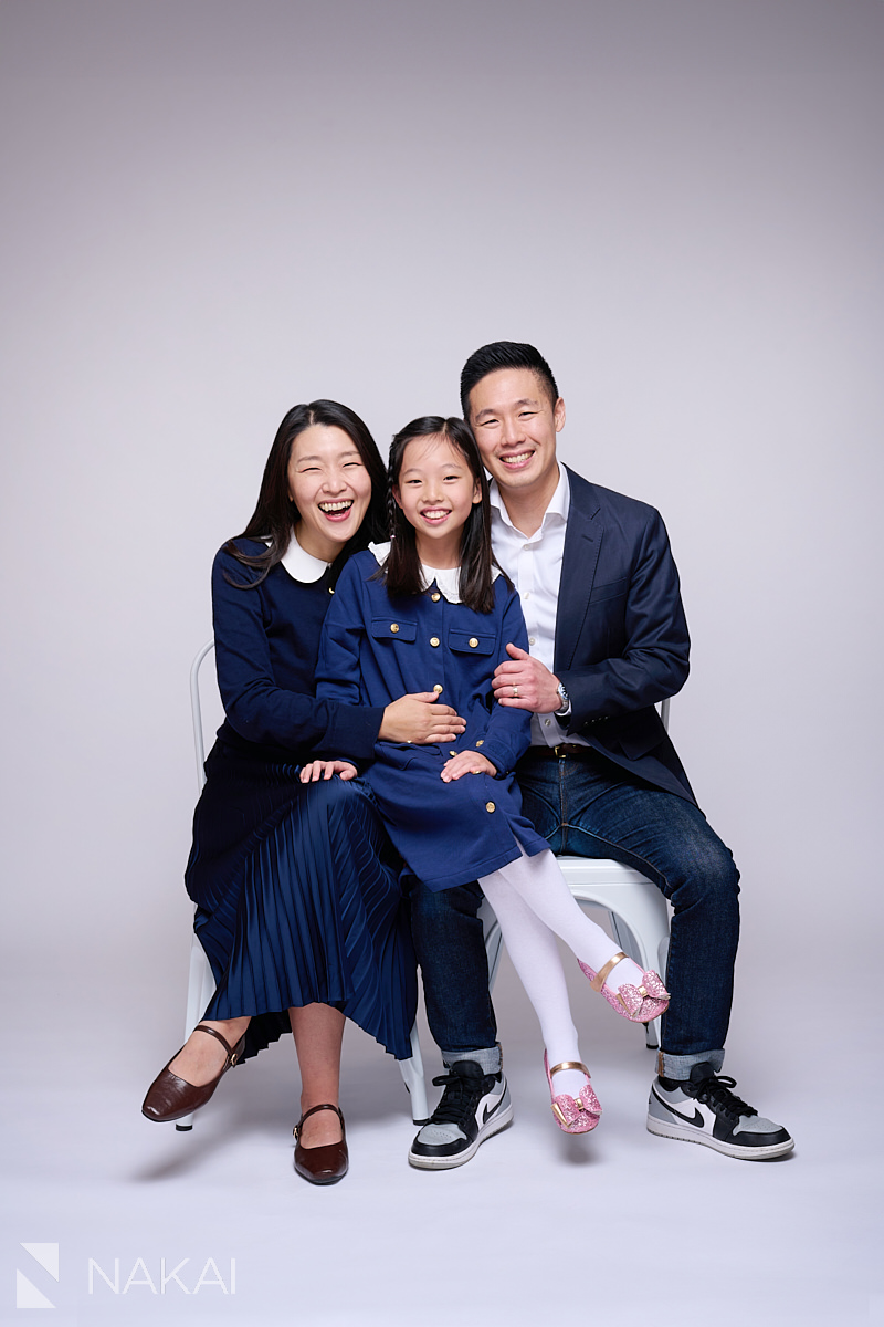 chicago portrait studio family pictures asian sitting on chairs